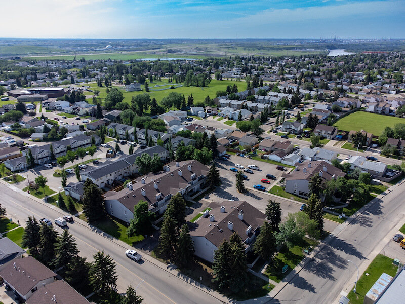 Street view of McCauley neighborhood in Edmonton, showcasing residential buildings and local atmosphere.