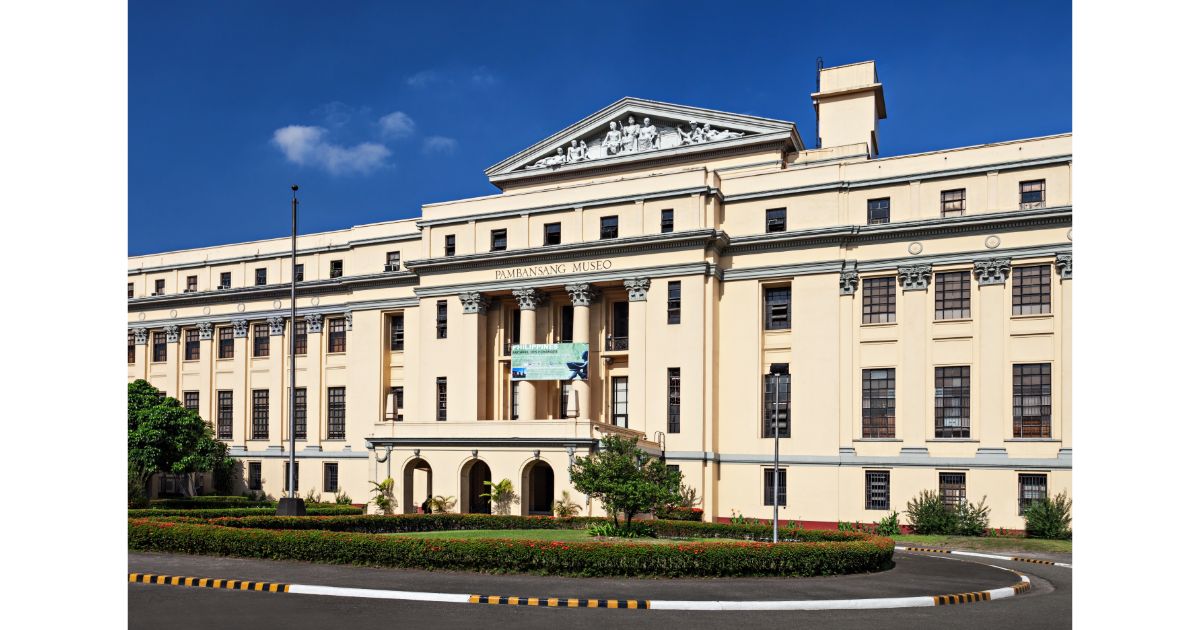 The National Museum of the Philippines (Pambansang Museo), showcasing its grand architecture under a clear blue sky.