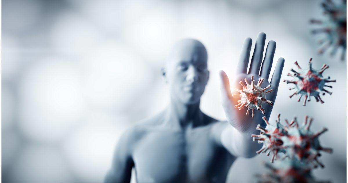 A digital representation of a human figure holding out their hand to block floating virus particles, symbolizing immune defense and protection.