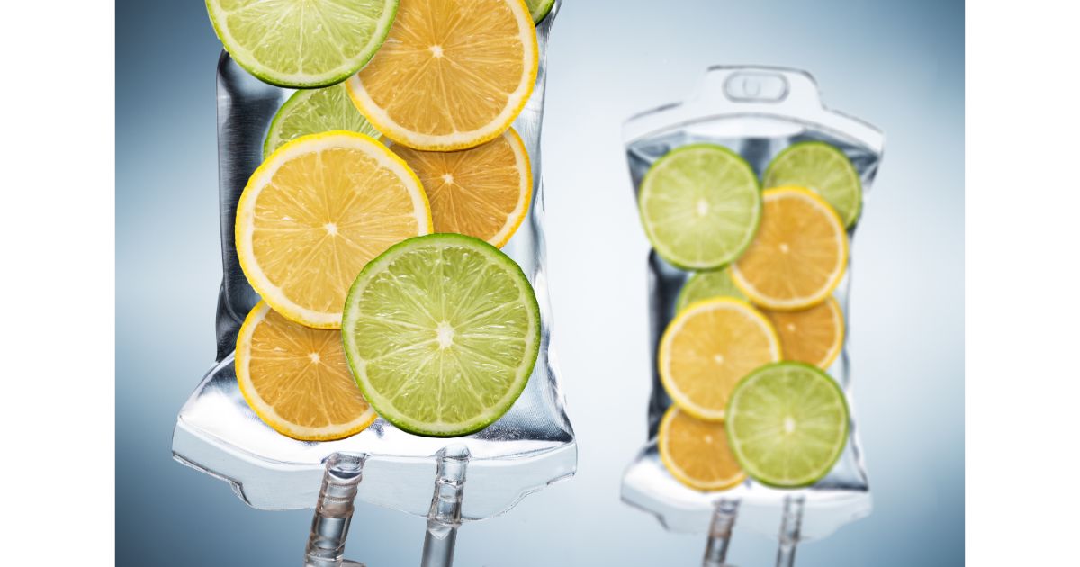 IV bag with slices of lemon and lime placed on top, symbolizing hydration and wellness with a fresh, citrus twist.