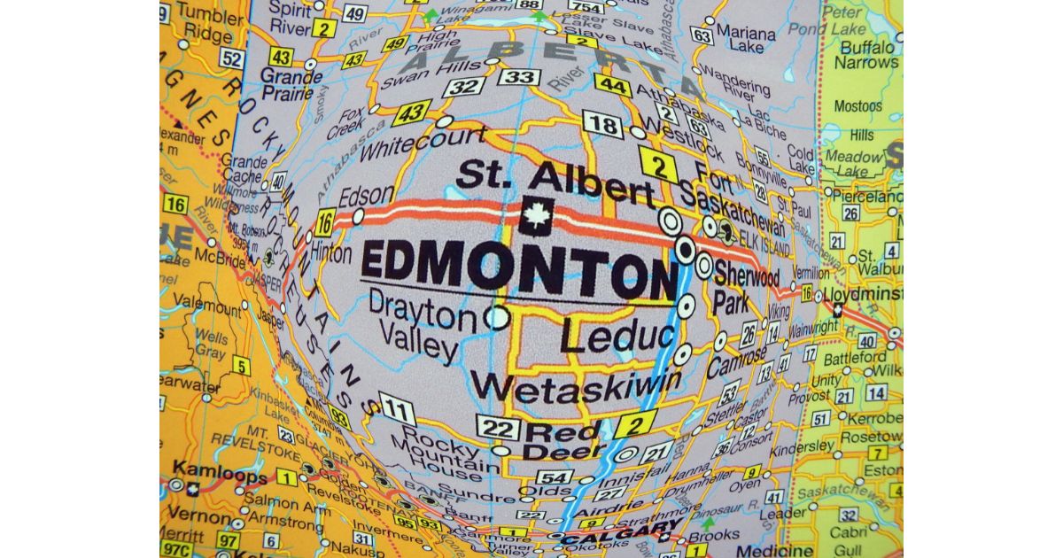 A close-up of a map focusing on Edmonton and surrounding areas, with a distorted effect highlighting the city’s location.