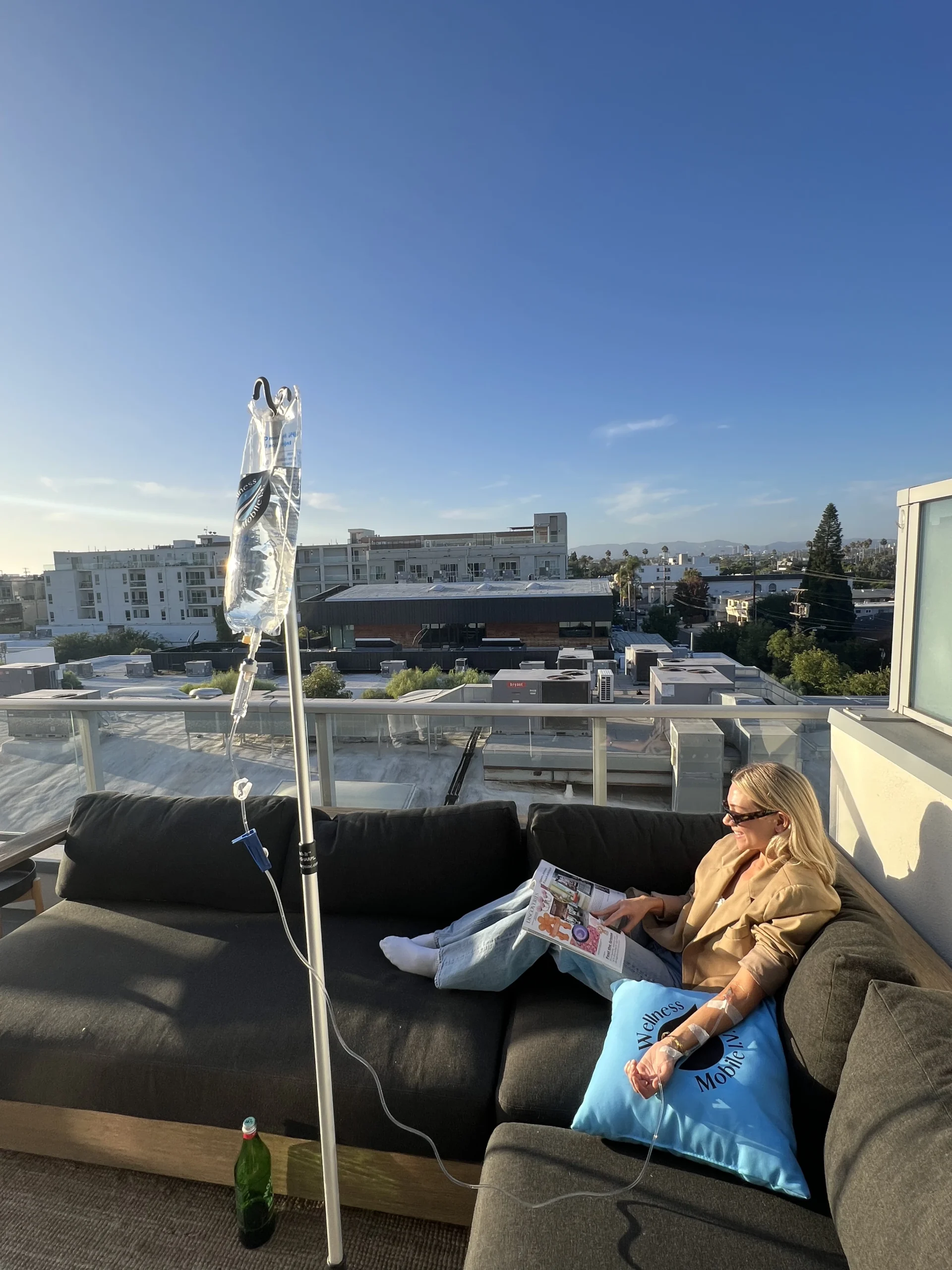 Women Enjoying IV Drip in the Rooftop while reading books and sitting in the couch