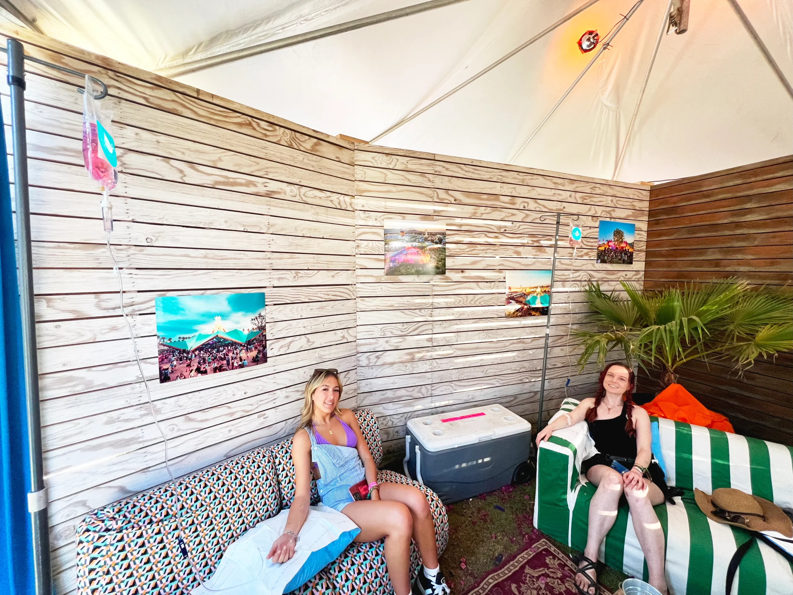Two women sitting using IV Drip Viva Wellness
