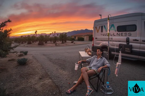 Viva Wellness nurse administering IV drip therapy to a Coachella attendee near Thermal California 