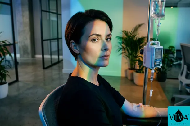 A professional mobile IV drip setup in a modern Dublin tech office environment.