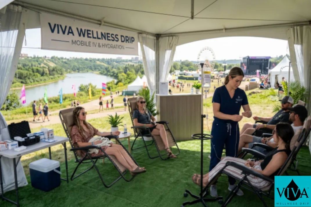 Mobile IV drip therapy set up in a tent or outdoor-adjacent space near Edmonton's river valley festival grounds